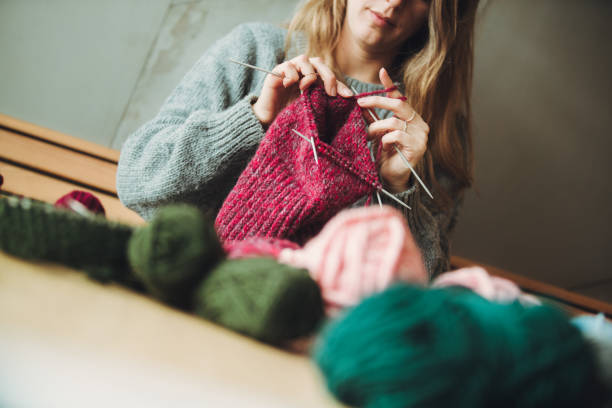 istock Close up on woman's hands knitting 1179065028