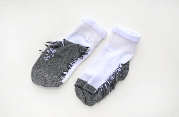 gire hacia fuera calcetines gris-blanco sobre fondo blanco. - inside out fotografías e imágenes de stock