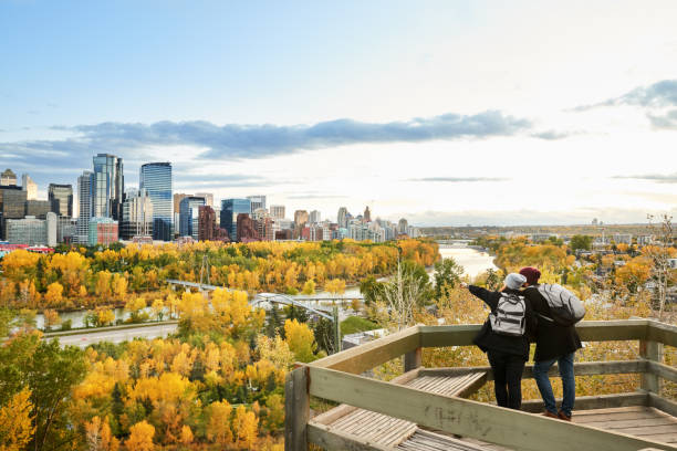 A couple exploring the city A couple overlooking the city of Calgary, Canada bow river stock pictures, royalty-free photos & images