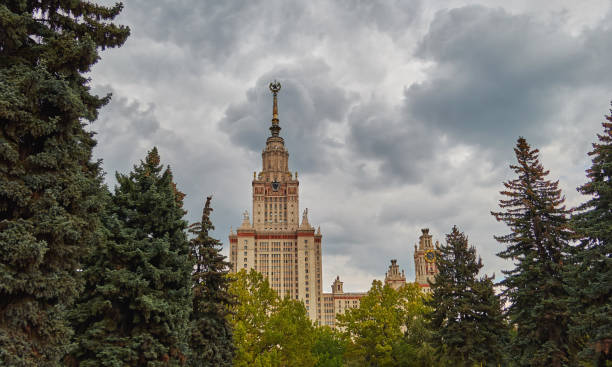 istock Famous Russian university campus with evergreen trees under dramatic rainy cloudy sky in summer 1179099449