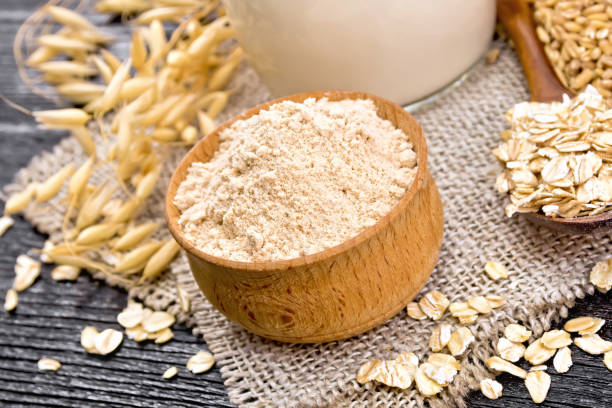 istock Flour oat in bowl on dark board 1179101324