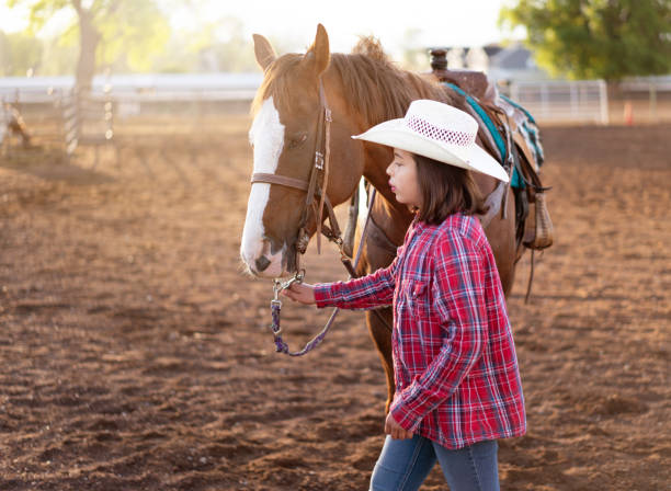 istock Cowgirl Horseback Riding 1179102819