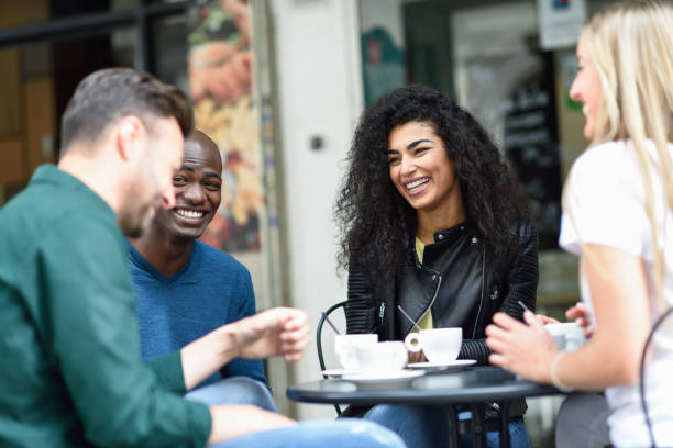 istock Multiracial group of four friends having a coffee together 1179103994