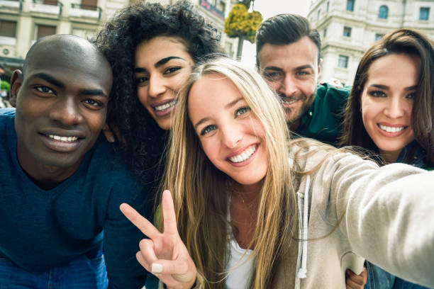 istock Multiracial group of young people taking selfie 1179104007