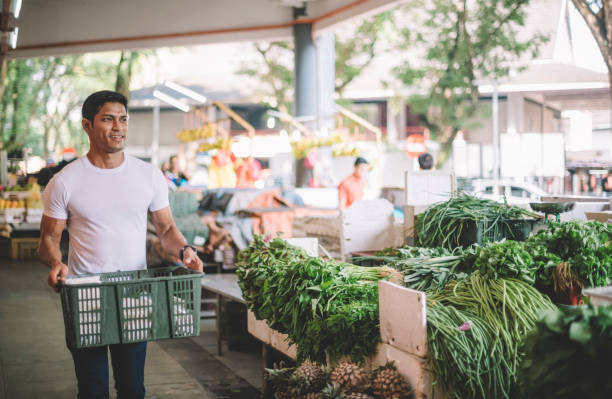 istock an asian malay vegetable owner arranging vegetables at his stall getting ready for the day 1179104848