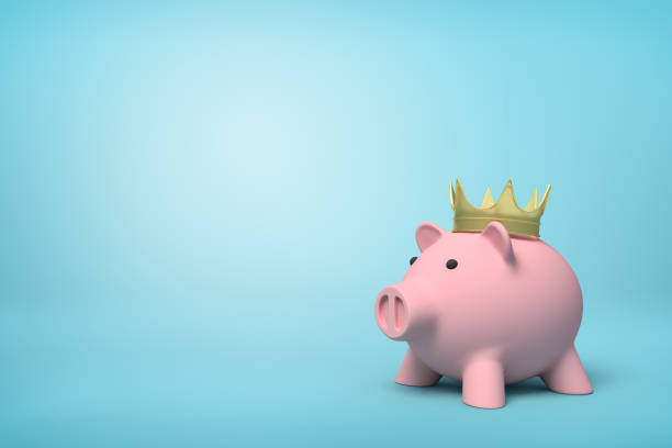istock 3d front close-up rendering of pink piggy bank wearing gold crown on light-blue background. 1179110600