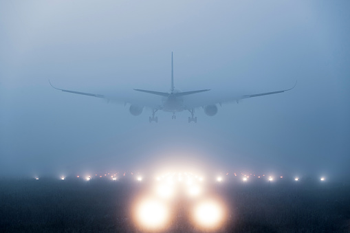 Airplane landing in fog