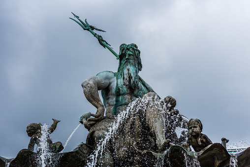 Statue of Neptune Fountain, one of the most iconic fountains of Berlin, Germany. Located on Alexanderplatz beside St Mary's Church and Berlin's Town Hall