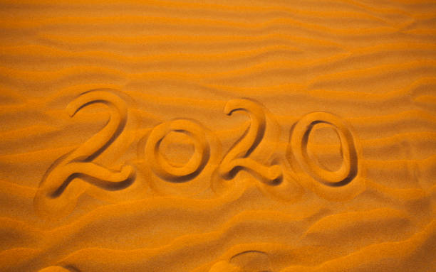 istock 2020 year written in the desert sand 1179111123