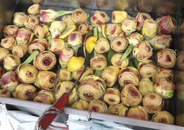 many fresh artichokes on the water for sale at market