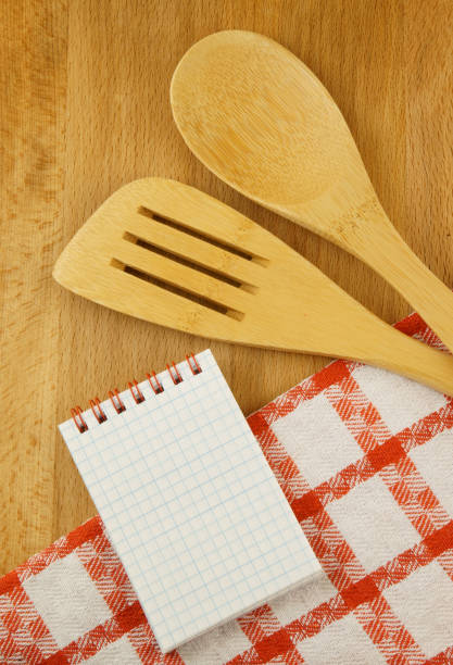 istock Cooking concept with notebook for recipes, tablecloths, spatula and spoon 1179114192