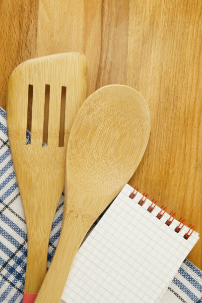 istock Cooking concept with notebook for recipes, tablecloths, spatula and spoon 1179114237