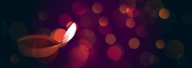 istock beautiful diwali diya on bokeh lights banner 1179114915