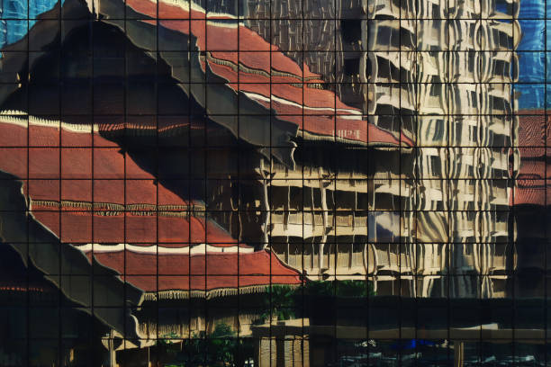istock juxtaposition, modern building curtain wall reflecting retro traditional style building 1179115121