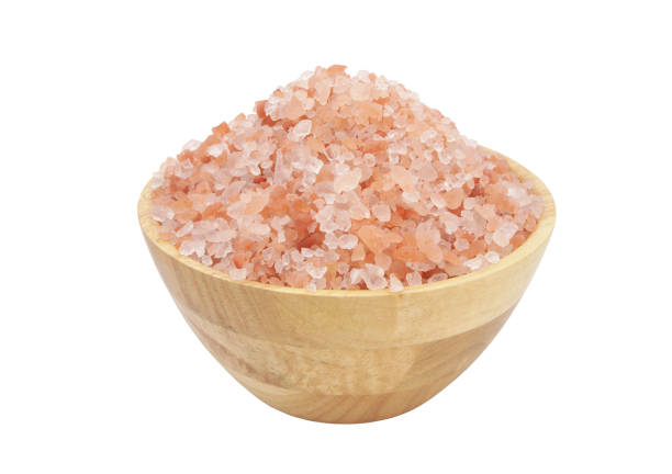 istock Himalayan rock salt in wooden bowl isolated on white 1179115963