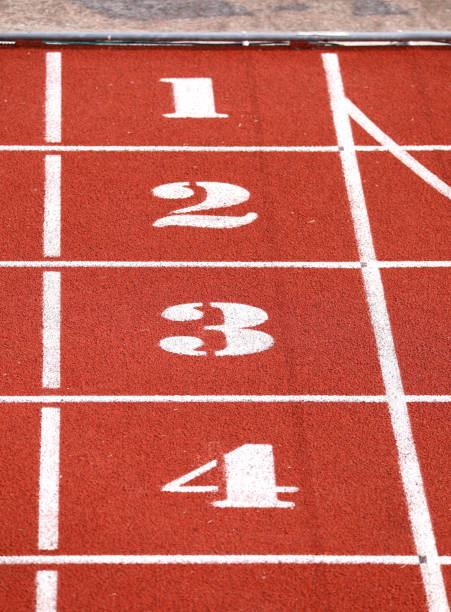 istock Finish line with numbers 1 2 3 4 on sport venue 1179116053