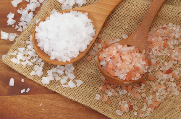istock Himalayan rock salt and white coarse salt 1179116177