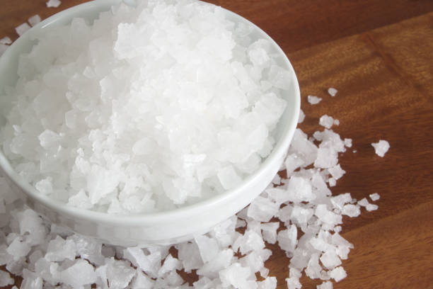 istock Coarse rock salt in bowl close up 1179116204