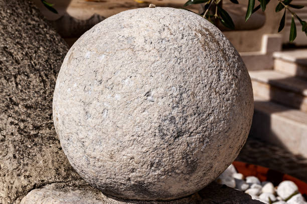 Close-up of an old stone sphere, detail of an Italian architecture, Vento, Italy