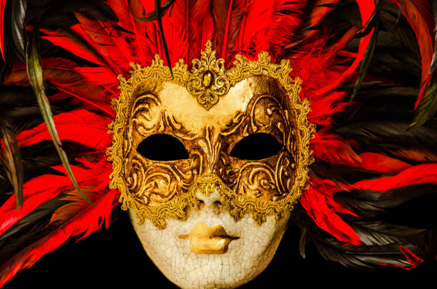 istock Read and golden Venetian carnival mask with red feathers 1179120628