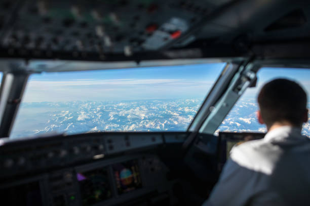 istock Pilot in  a commercial airliner airplane flight cockpit during flight 1179121766
