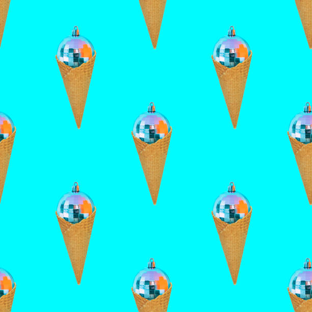 Pattern of Christmas decorations balls in a waffle cones like ice cream on blue background. The concept of the winter sweets