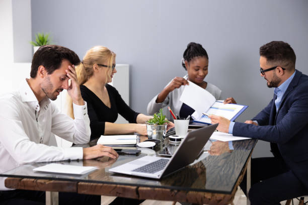 istock Bored Manager Sitting At Presentation In Meeting 1179124127