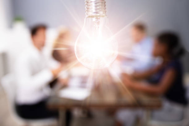 istock Lightbulb On In Front Of People In The Meeting 1179124140