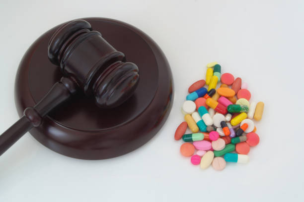 istock Judge gavel with drugs on white table 1179124691