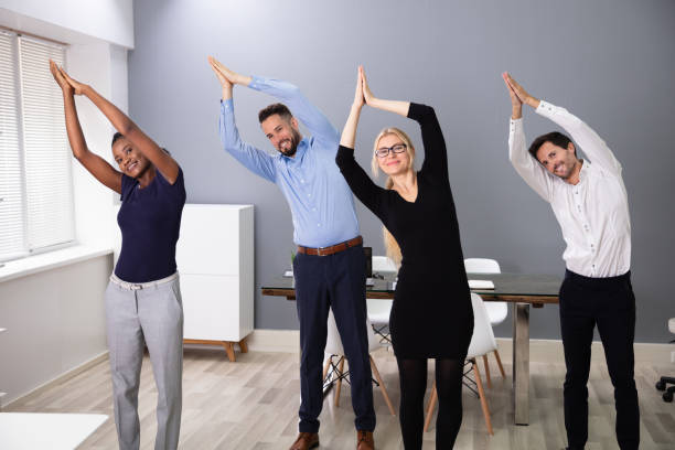 istock Businesspeople Doing Yoga At Office 1179124738
