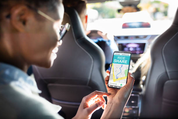 African Woman Using Car Sharing App African Woman Using Car Sharing App While Sitting In Car car pooling stock pictures, royalty-free photos & images