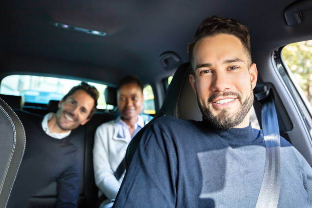 istock Happy Young Friends Sitting Inside Car Enjoying Trip 1179125119