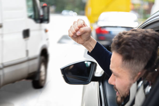 istock Man Clenching His Fist Looking Out Through Car Window 1179125143