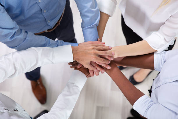istock Multiracial Businesspeople Stacking Hands Over Each Other 1179125247