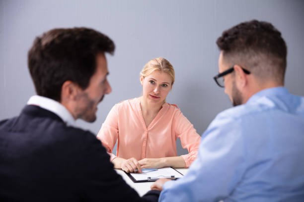 istock Two Men At Interview At Adoption Agency 1179125354
