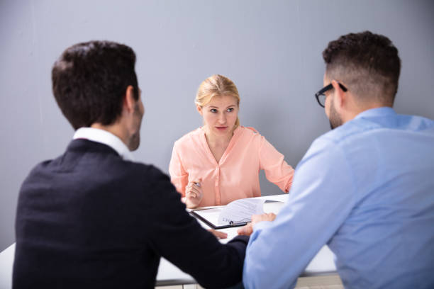 istock Two Men At Interview At Adoption Agency 1179125360