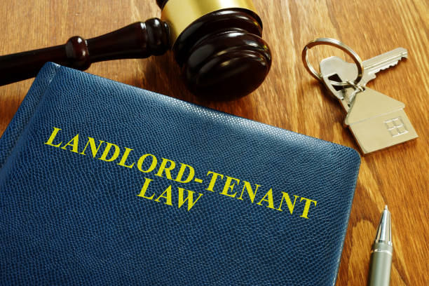 Landlord Tenant Law book and key from home. Landlord Tenant Law book and key from home. tenant stock pictures, royalty-free photos & images