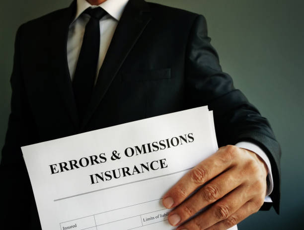 Errors and omissions E&O insurance or professional liability policy in the hands. Errors and omissions E&O insurance or professional liability policy in the hands. Errors and Omissions (E&O) Insurance stock pictures, royalty-free photos & images