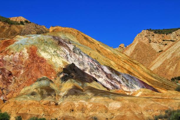 istock Mineral streaks and sediments in a old abandoned quarry 1179129036