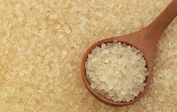 istock Pure brown rock sugar with wooden spoon 1179132205