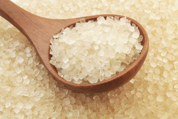 istock Pure brown rock sugar with wooden spoon 1179132215