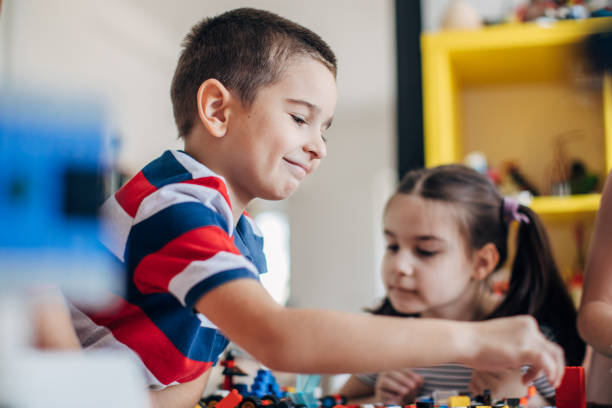 istock Kids playing with toy cubes 1179132658