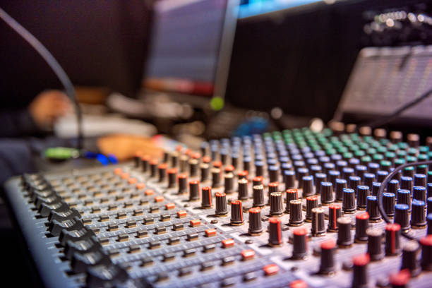 The operator controls the video and audio mixer