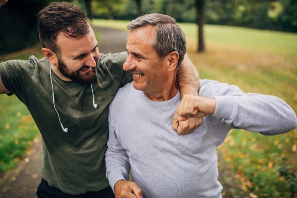 istock Father and son jogging in park 1179137692