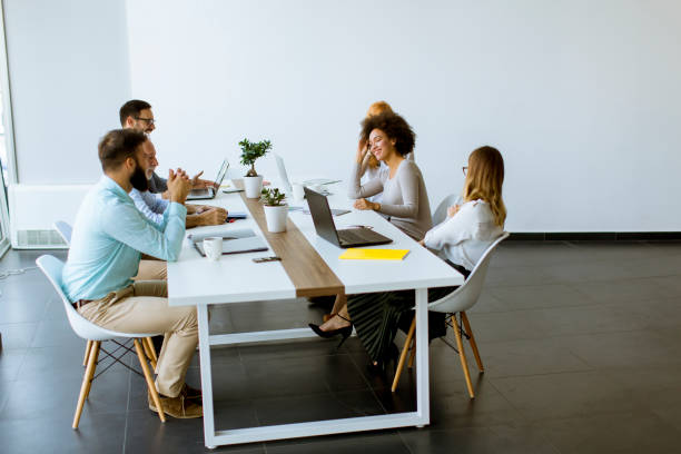 istock Joyful multiracial business team at work in modern office 1179138624