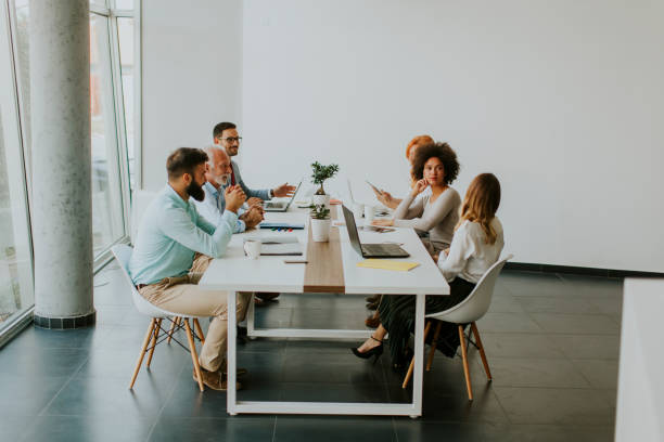 istock Joyful multiracial business team at work in modern office 1179138639