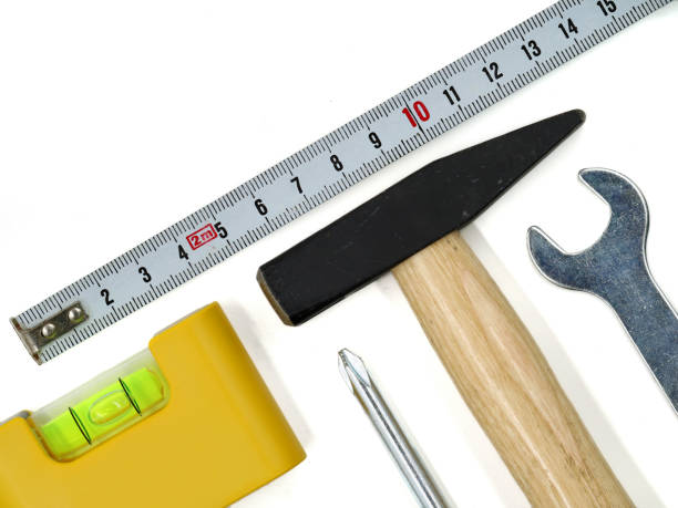 istock top view of working tools isolated on white background. set of tools with hammer, level, screwdriver, wrench and tape measure, copy space 1179141518