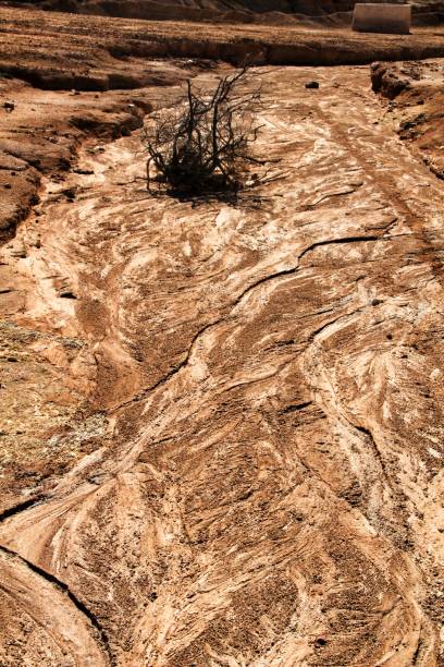 istock Sediments, rock formations and mineral streaks in an old abandoned quarry 1179142196