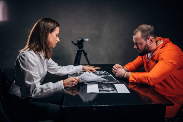 istock Prisoner and female detective 1179142606