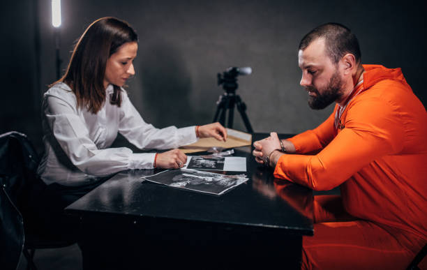 istock Prisoner and female detective 1179142678